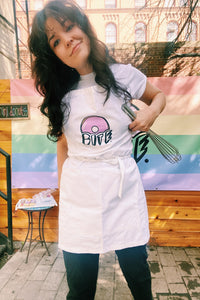 queer owned mini donut bakery in brooklyn nyc selling baked, artisan, custom, mini donuts and merchandise like aprons, hats, and t-shirts. custom dessert catering nyc baked mini donuts