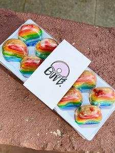 the gay donut, pride dessert, pride themed dessert, rainbow dessert, rainbow mini donuts, rainbow donut, queer owned bakery, gay owned bakery nyc, pride dessert catering, coming out day gift, pride gift, pride donut